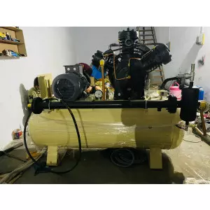 10 HP Piston Air Compressor Unit Installed In An Industrial Plant